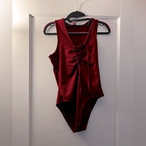 Red body suit, fleece lining, ties in the front